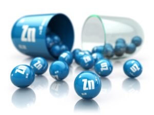 a blue pills spilling out of a pill bottle